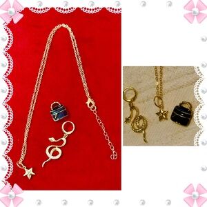 Necklace 18-22” gold tone chain w/3 charms - snake, star, purse. Great! BOGO